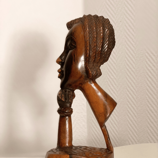 Wooden female face art object, height 25 cm