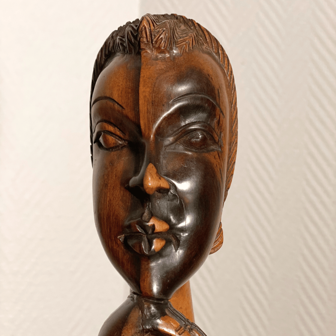 Wooden female face art object, height 25 cm